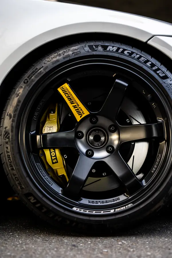 Wheel and yellow brake caliper