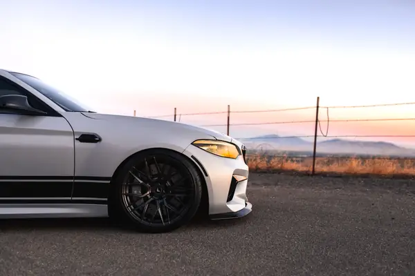 White BMW M2 Competition at sunset