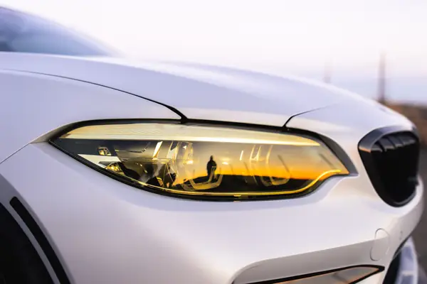 Close-up of the yellow-tinted headlight